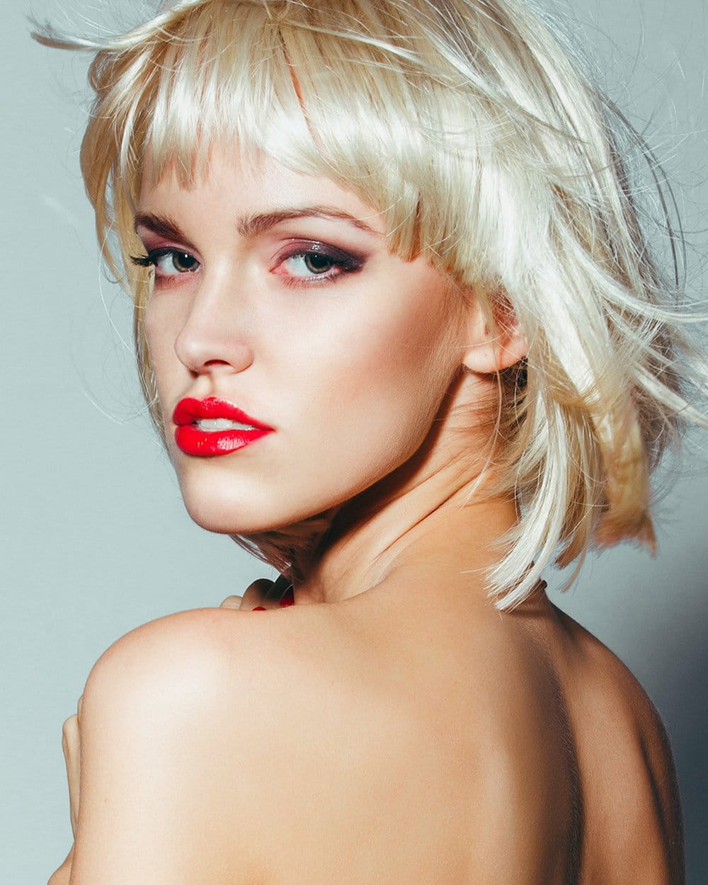 ballancerpro patient model looking over her shoulder wearing bright red lipstick